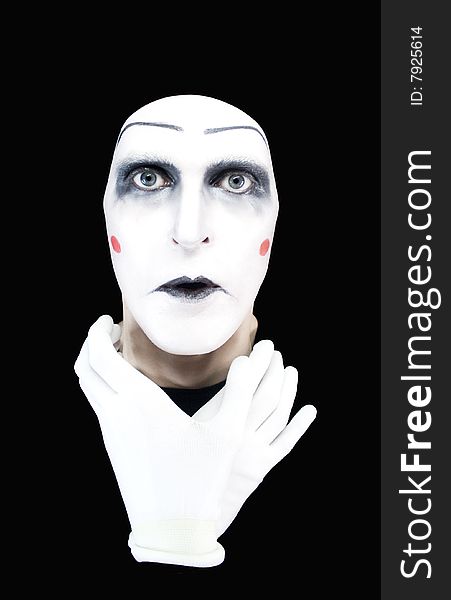 Mime with hands on a neck on a black background