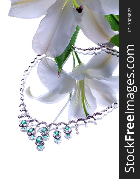 Emerald necklace from white gold and a lily. Emerald necklace from white gold and a lily