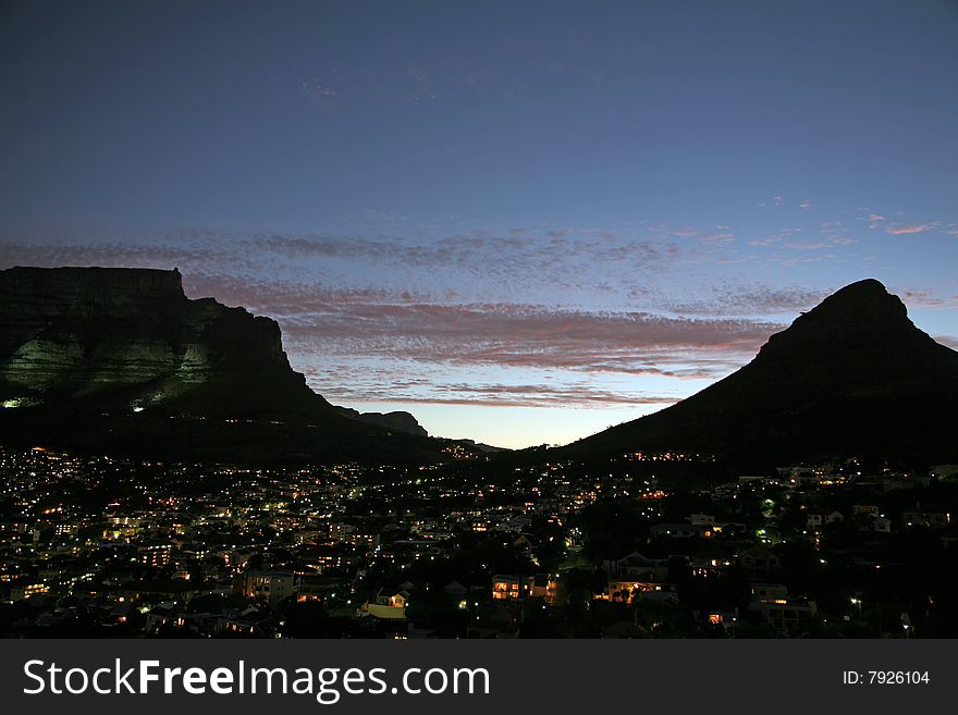 Cape town dusk panorama of Table mountain, Lion head and lighting Downtown. Cape town dusk panorama of Table mountain, Lion head and lighting Downtown.