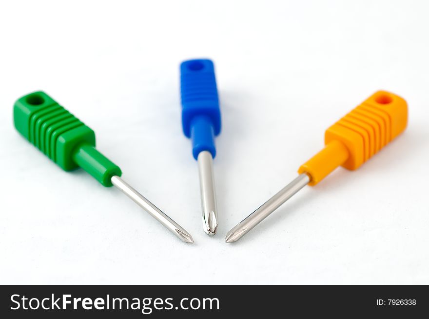 3 colorful plus-type screwdrivers on a white background. 3 colorful plus-type screwdrivers on a white background