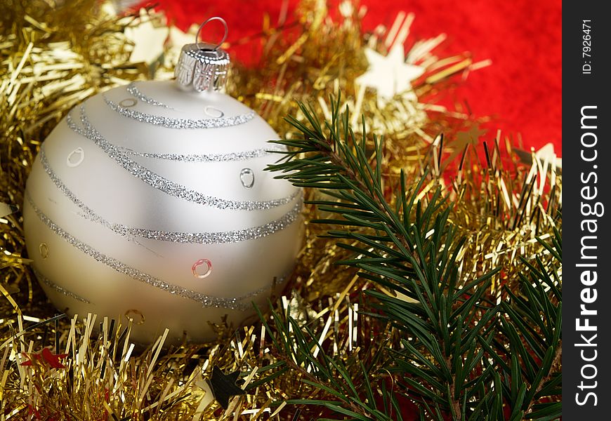 The Christmas ball on red background