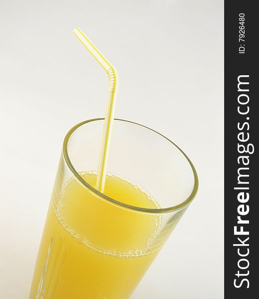Glass of orange juice isolated over a white background.
