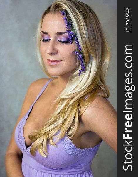 Blond girl in lilac style studio shot. Blond girl in lilac style studio shot