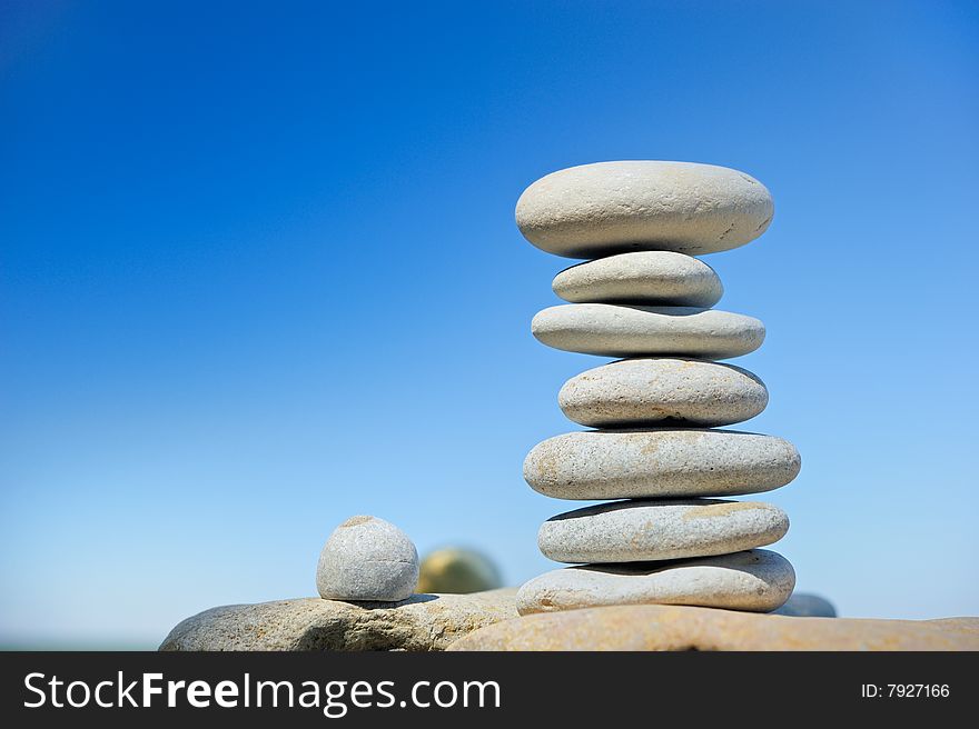 Seven sea stones on a beach in the summer morning. Seven sea stones on a beach in the summer morning