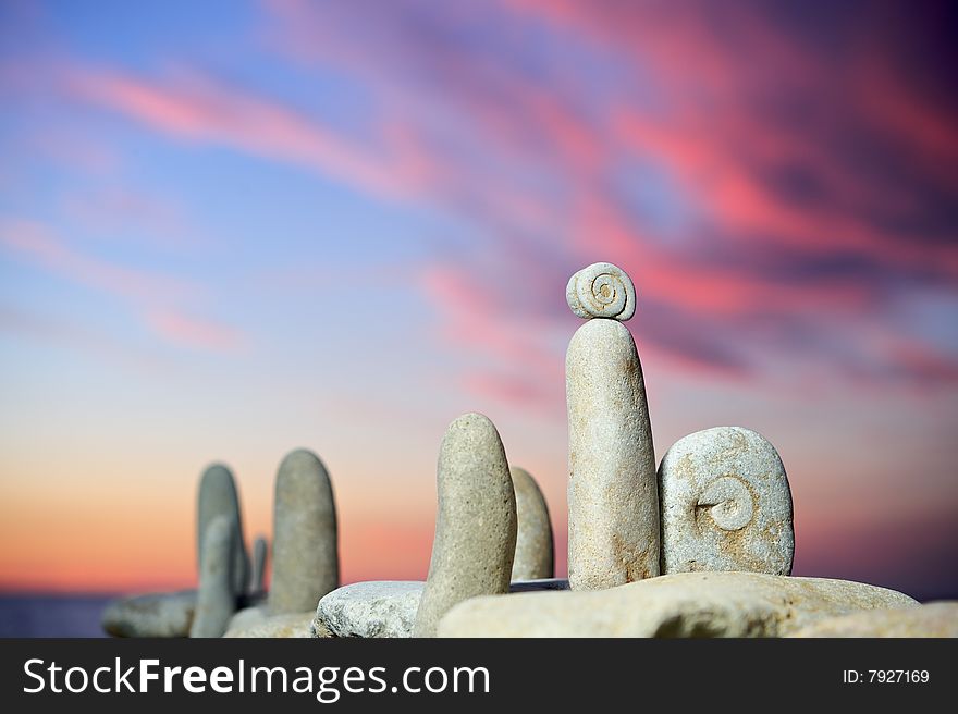 Sea stones in evening light on a beach in the summer. Sea stones in evening light on a beach in the summer