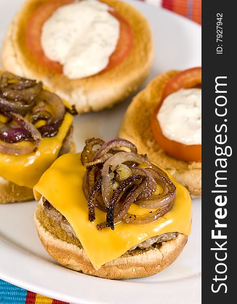 Cheeseburger with fried onions tomato and white sauce. Cheeseburger with fried onions tomato and white sauce