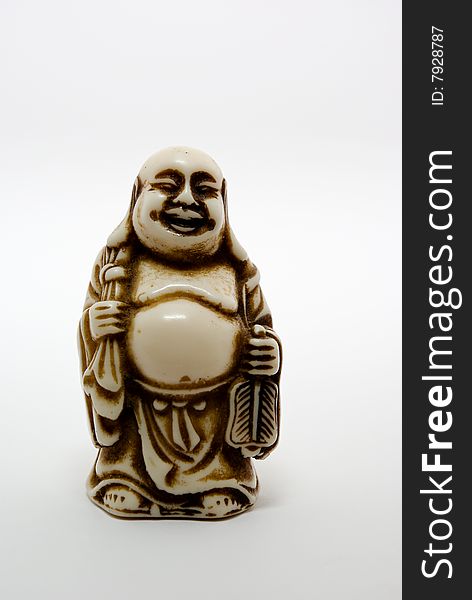 Handmade ceramic figure of Buddha on white. Handmade ceramic figure of Buddha on white