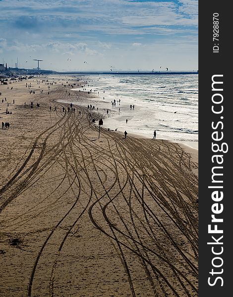 High view of a beach with tire marks. High view of a beach with tire marks.