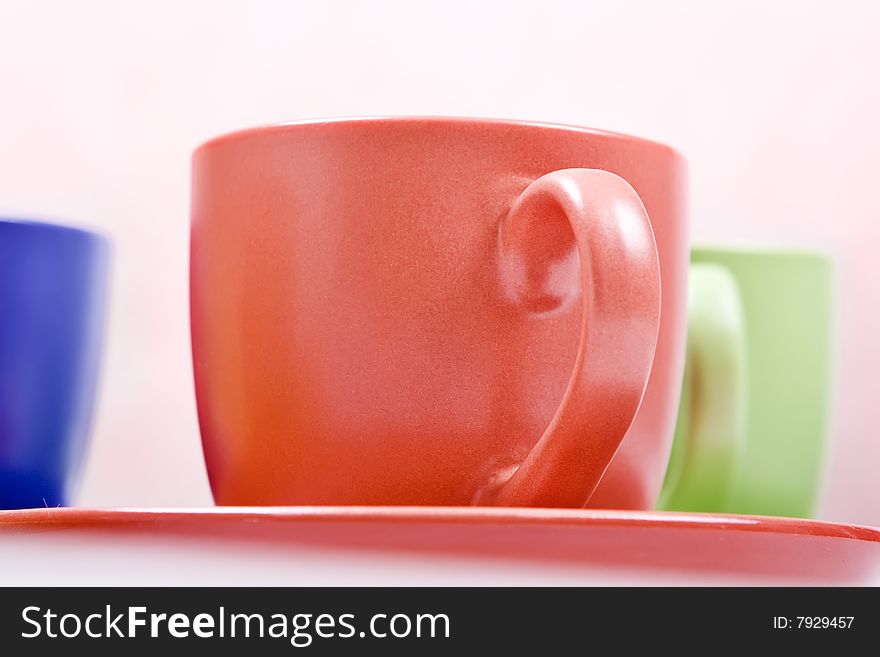 Color cups on saucers closeup