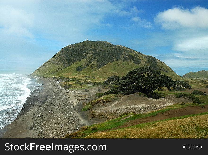 Lighthouse on a hill by the beach. Lighthouse on a hill by the beach