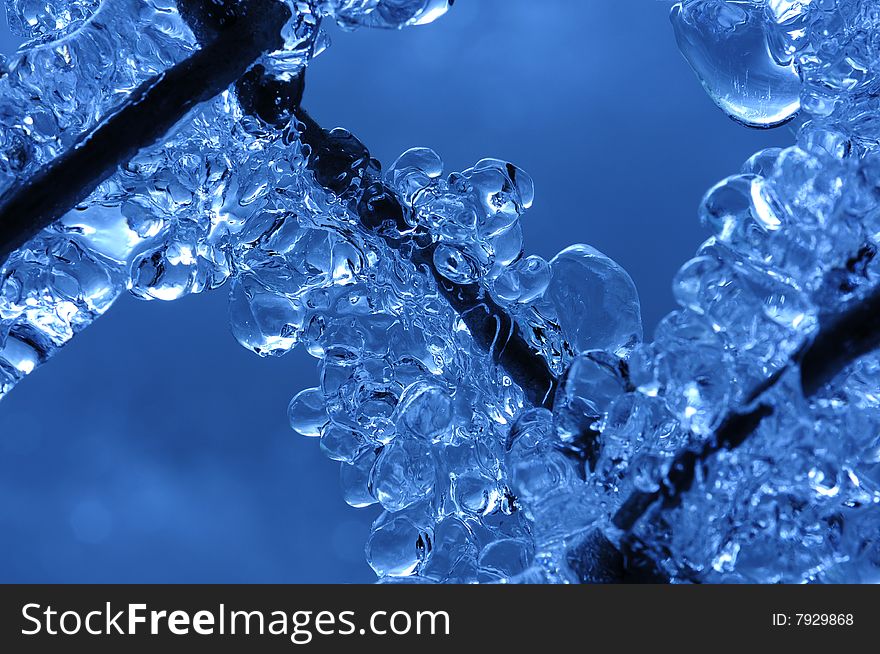 Frozen water droplets trapped on a chainlink fence. Frozen water droplets trapped on a chainlink fence