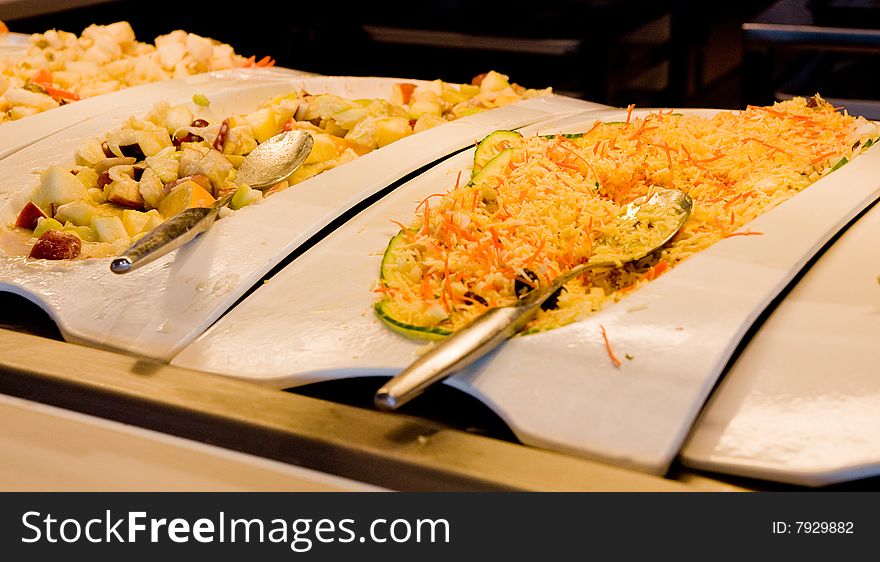 A selection of fresh made salads at a buffet. A selection of fresh made salads at a buffet
