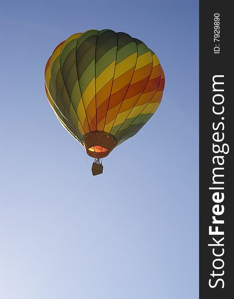 A vertical image of a hot air balloon. A vertical image of a hot air balloon