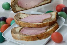 Easter Ham On Bread With Colored Eggs Royalty Free Stock Photo