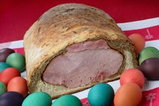 Easter Ham On Bread With Colored Eggs Royalty Free Stock Images