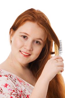 The Young Beautiful Woman Combs Long Red Hair Royalty Free Stock Photos The Young Beautiful Woman Combs Long Red Hair Royalty Free Stock Photos