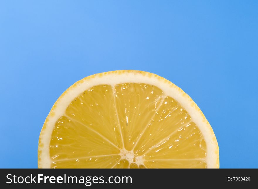 Juicy lemon isolated on blue background. Juicy lemon isolated on blue background
