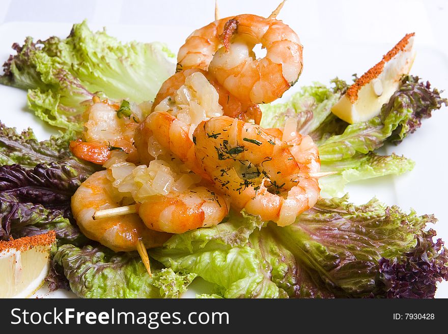 Shrimp's salad on white plate