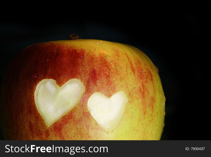 Big apple with hearts on black background. Big apple with hearts on black background