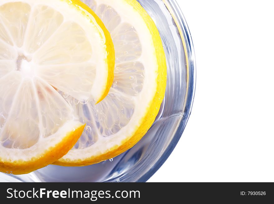 Glass full of water or another drink with lemon. Glass full of water or another drink with lemon