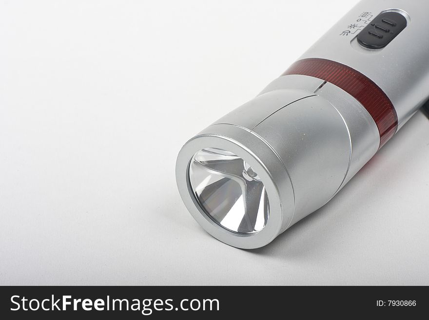 Grey flashlight on white background