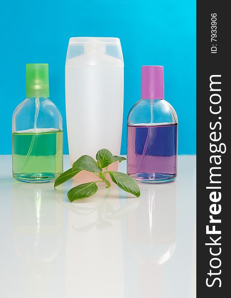 Perfumery bottles on a color background