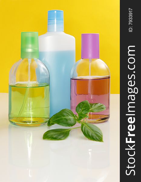Perfumery bottles on a color background