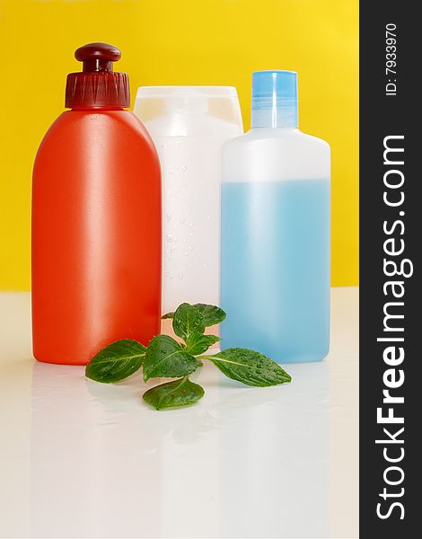 Perfumery bottles on a color background