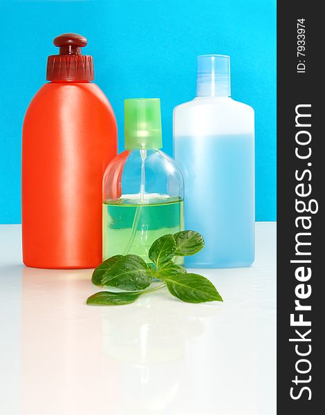 Perfumery bottles on a color background