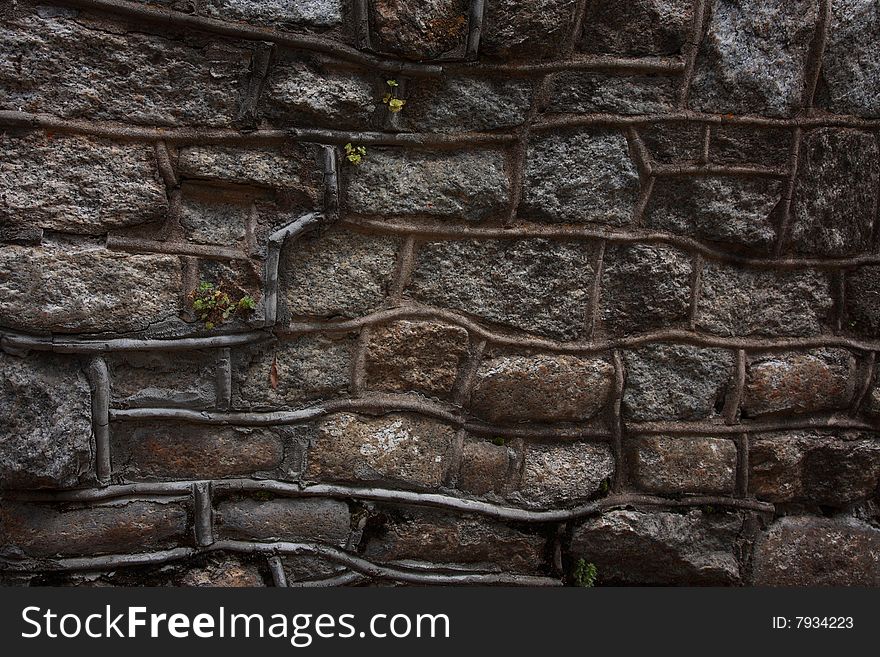 Rustic Random Stone Wall with thick Mortar and Weeds