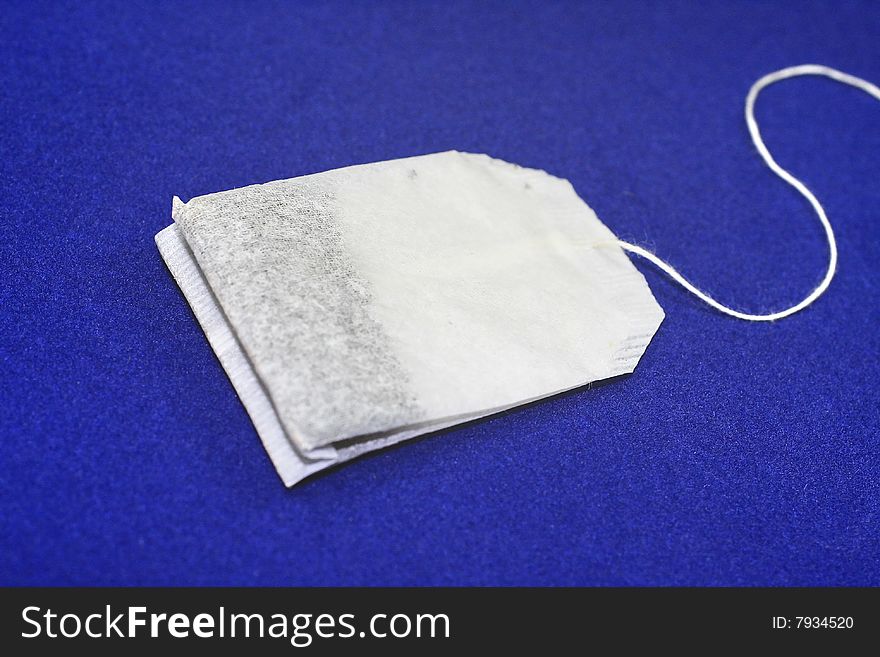 White package of tea on a dark blue background