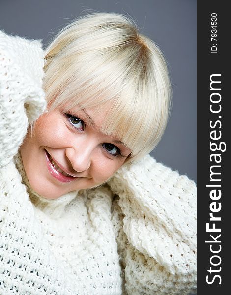 Close-up portrait of lovely blond woman indoors