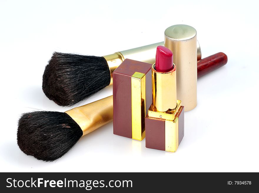 Makeup brushes and lipsticks isolated on white. Makeup brushes and lipsticks isolated on white.