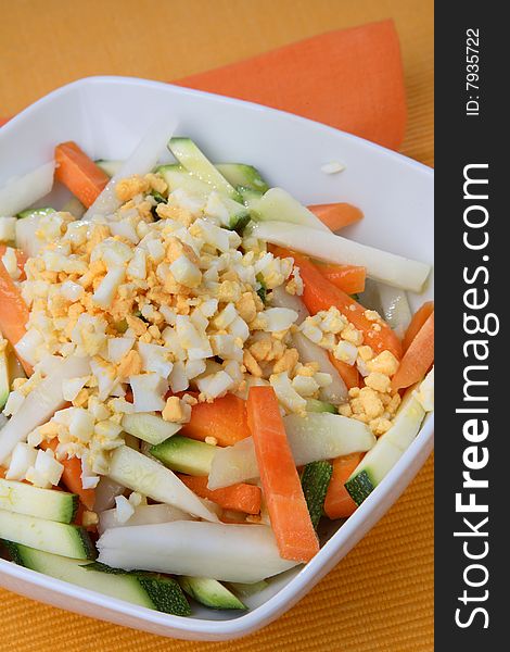 Boiled egg cubes with fresh vegetable
