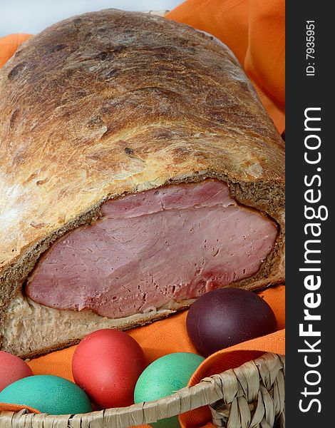 Easter ham on bread with colored eggs