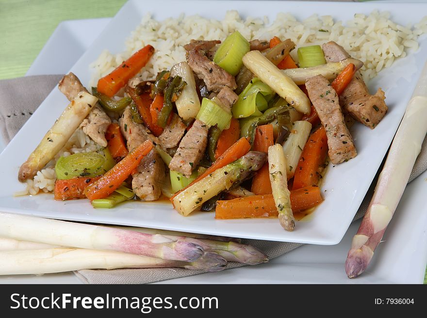 Meat with vegetable mix on plate