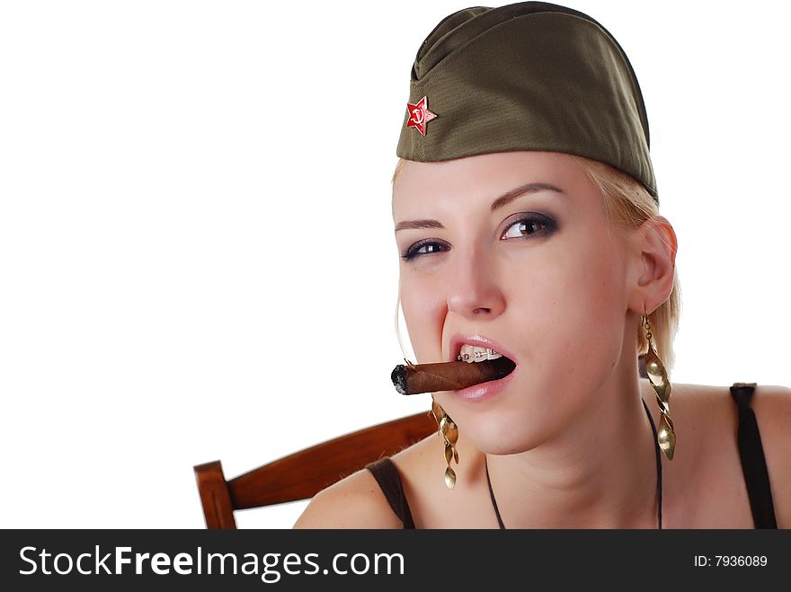 Beautiful woman in field cap with cigar