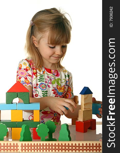 Little girl playing with cubes