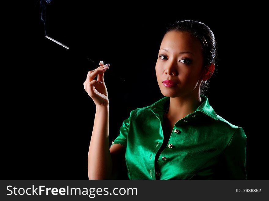 Portrait of a beautiful young woman with cigarette