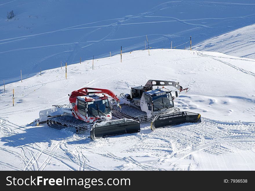 Two snow cats on the Alps slope. Two snow cats on the Alps slope