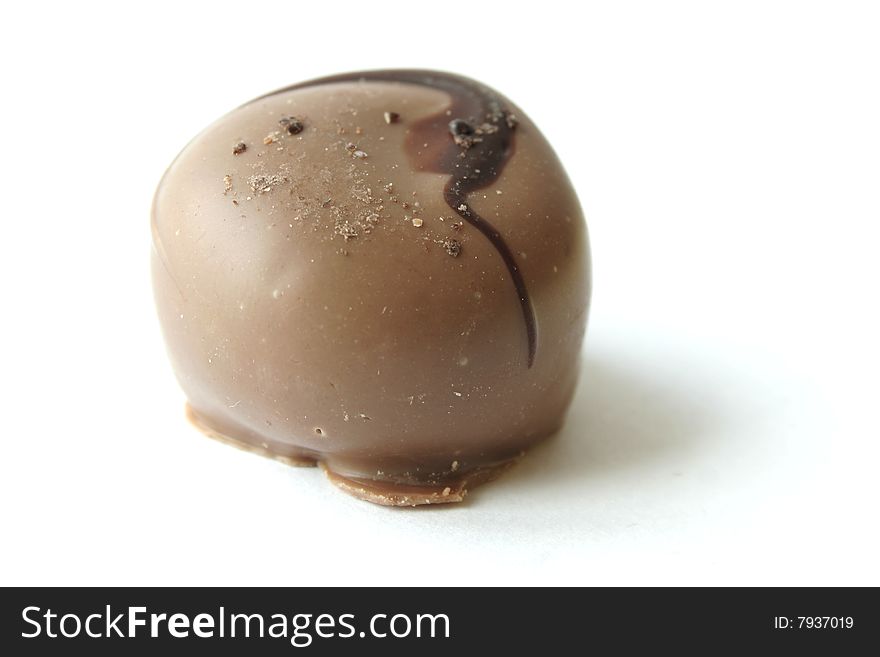 A rounded piece of chocolate candy