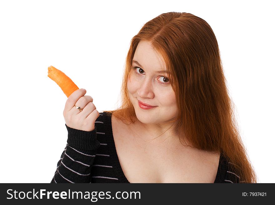 The young beautiful woman with long red hair and a carrot. The young beautiful woman with long red hair and a carrot