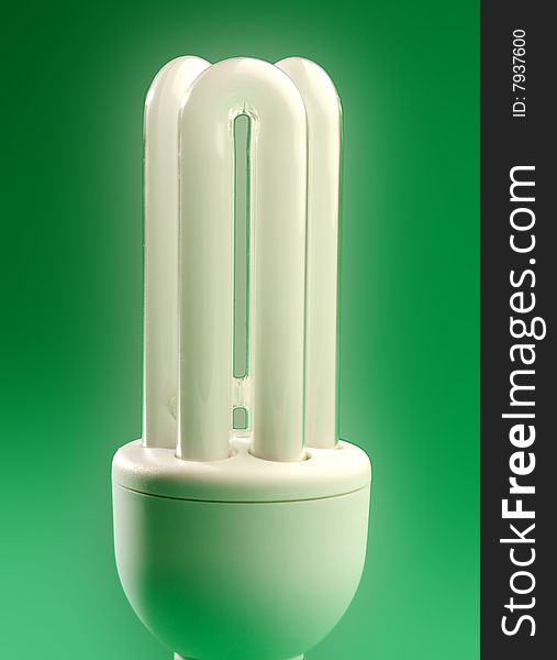 New energy saving Light bulb on a green background