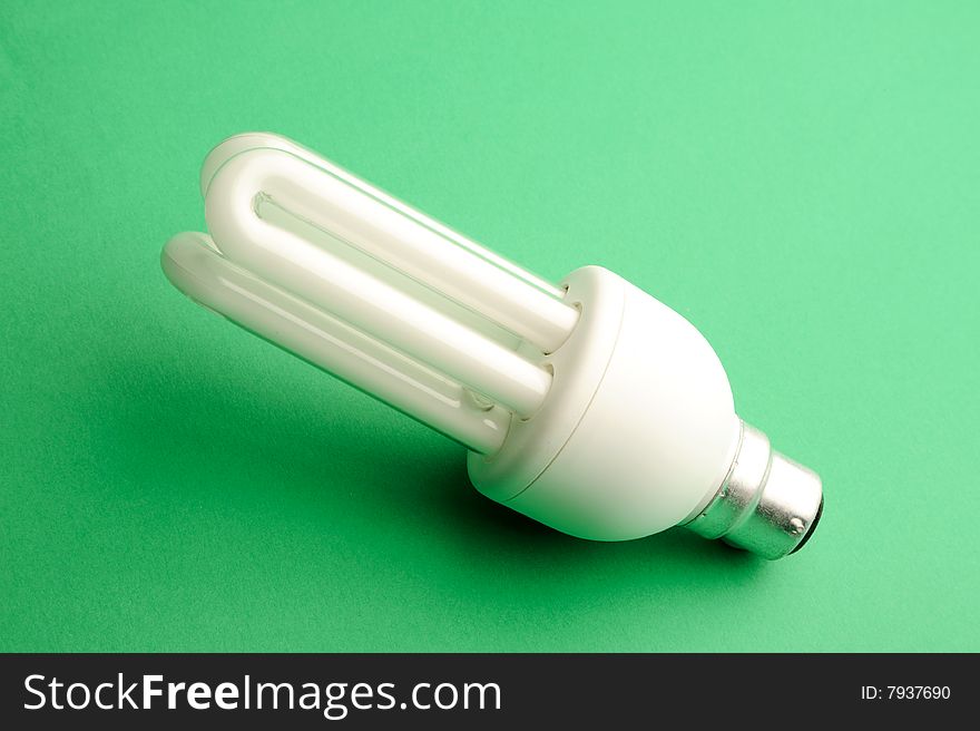 New energy saving Light bulb on a green background