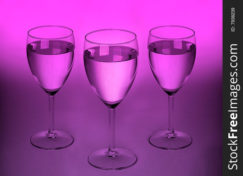 Three modern glasses with purple light