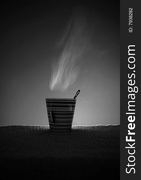 Hot smoking tea in black-and-white photography. Hot smoking tea in black-and-white photography