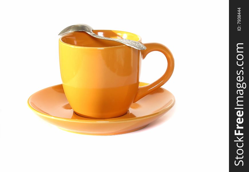 Cup for tea on a saucer and with a spoon