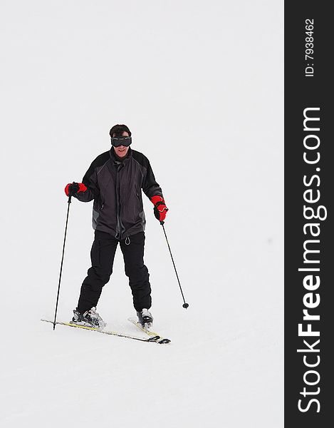 Portrait of man doing snowplough. Portrait of man doing snowplough