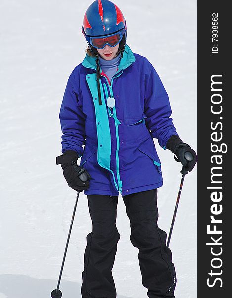 Portrait of girl skiing downhill