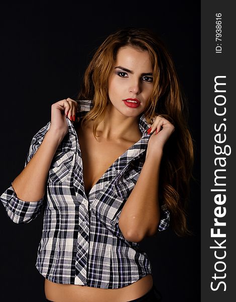 Beautiful woman in cheked shirt holding her collar